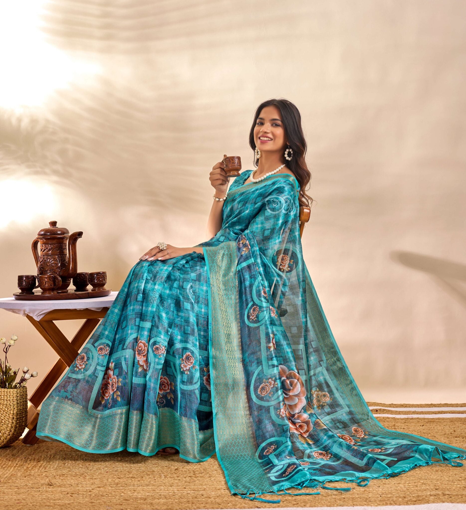 This elegant teal blue soft Saree