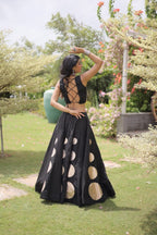 Roman Silk Navratri Lehenga Choli with Mirror Lace Work and 6 Meter Flair fabric texture detail