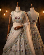 Cream Butterfly Net Lehenga Choli with Heavy Embroidery Work and Net Dupatta back view