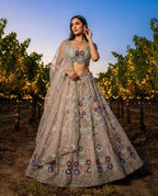 Cream Butterfly Net Lehenga Choli with Heavy Embroidery Work and Net Dupatta front view