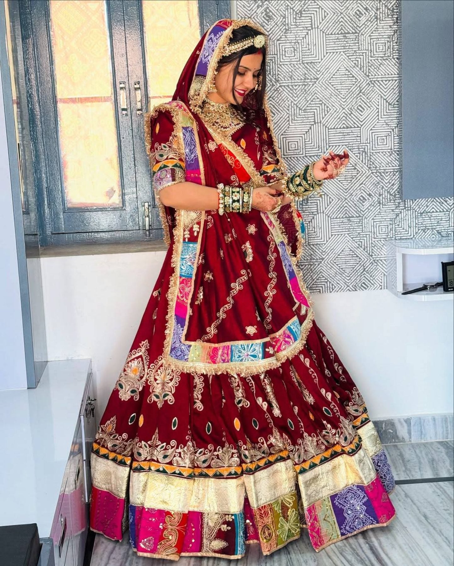 Red Digital Print Lehenga with Mirror Work and Gota Patti Detailing fabric texture detail
