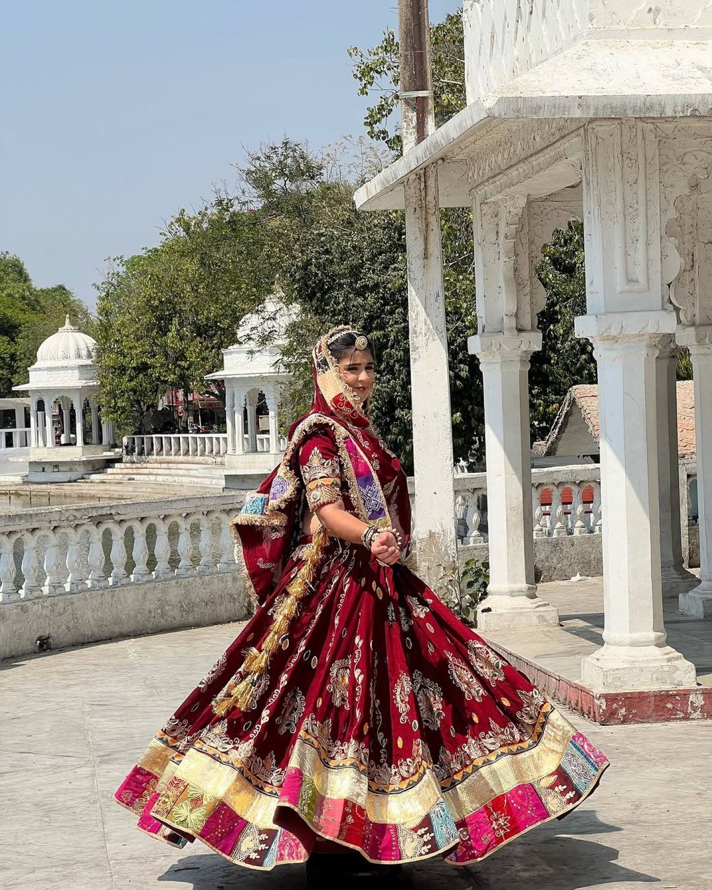 Red Digital Print Lehenga with Mirror Work and Gota Patti Detailing fabric texture detail