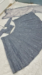 Grey Wedding Wear Lehenga with Heavy Embroidery and Tassel Dupatta front view