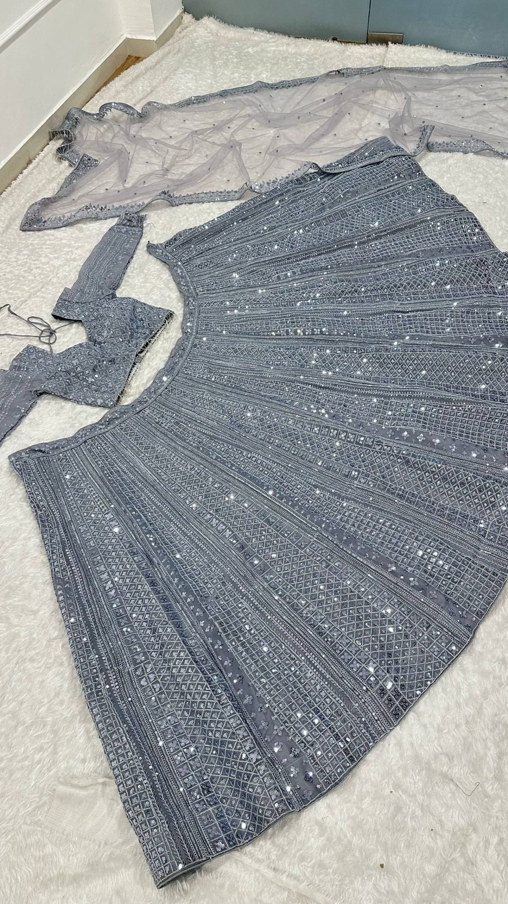 Grey Wedding Wear Lehenga with Heavy Embroidery and Tassel Dupatta front view