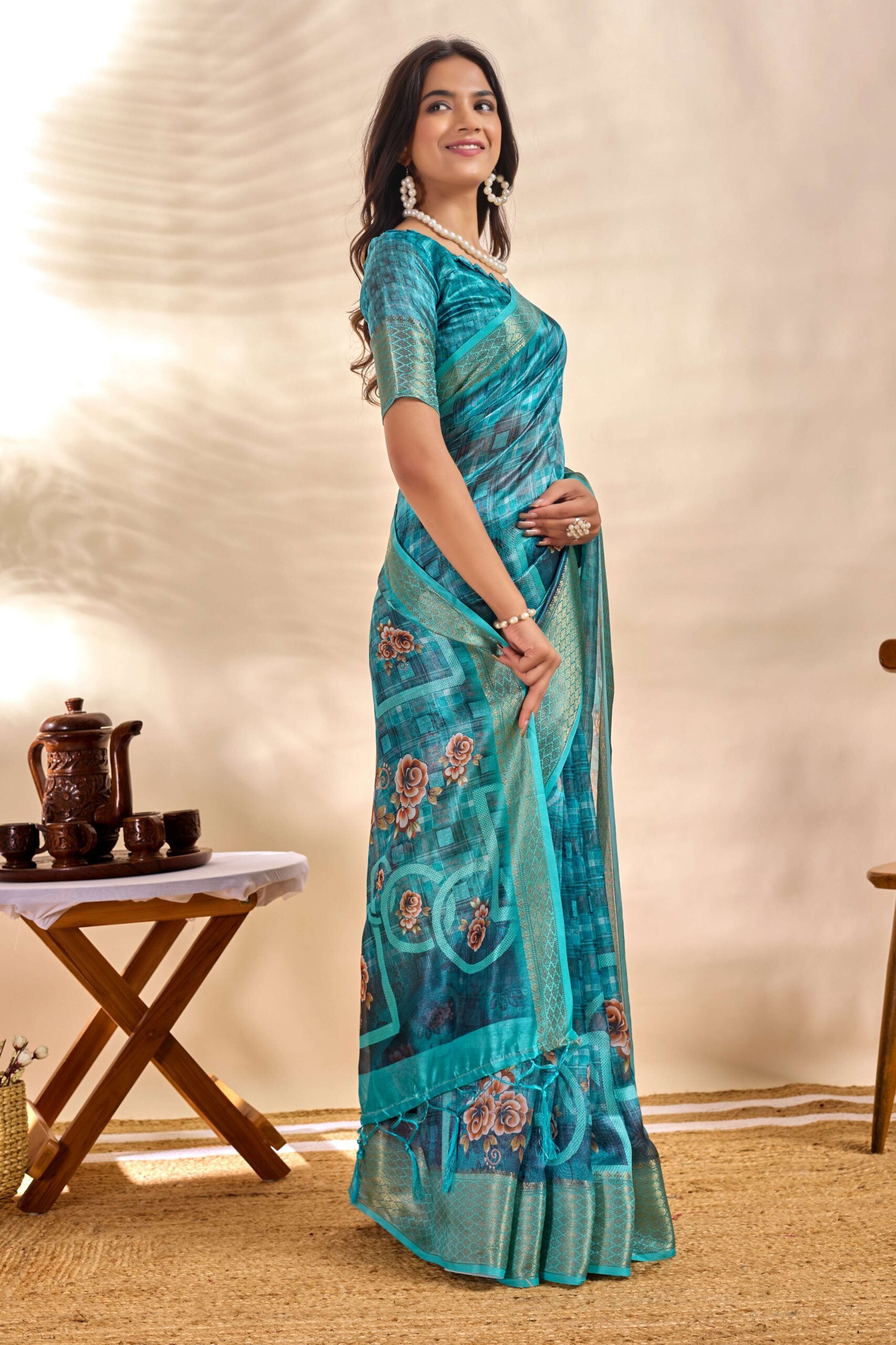 This elegant teal blue soft Saree