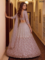 Pink Net Lehenga Choli with Sequins and Zari Embroidery For Bridal fabric texture detail