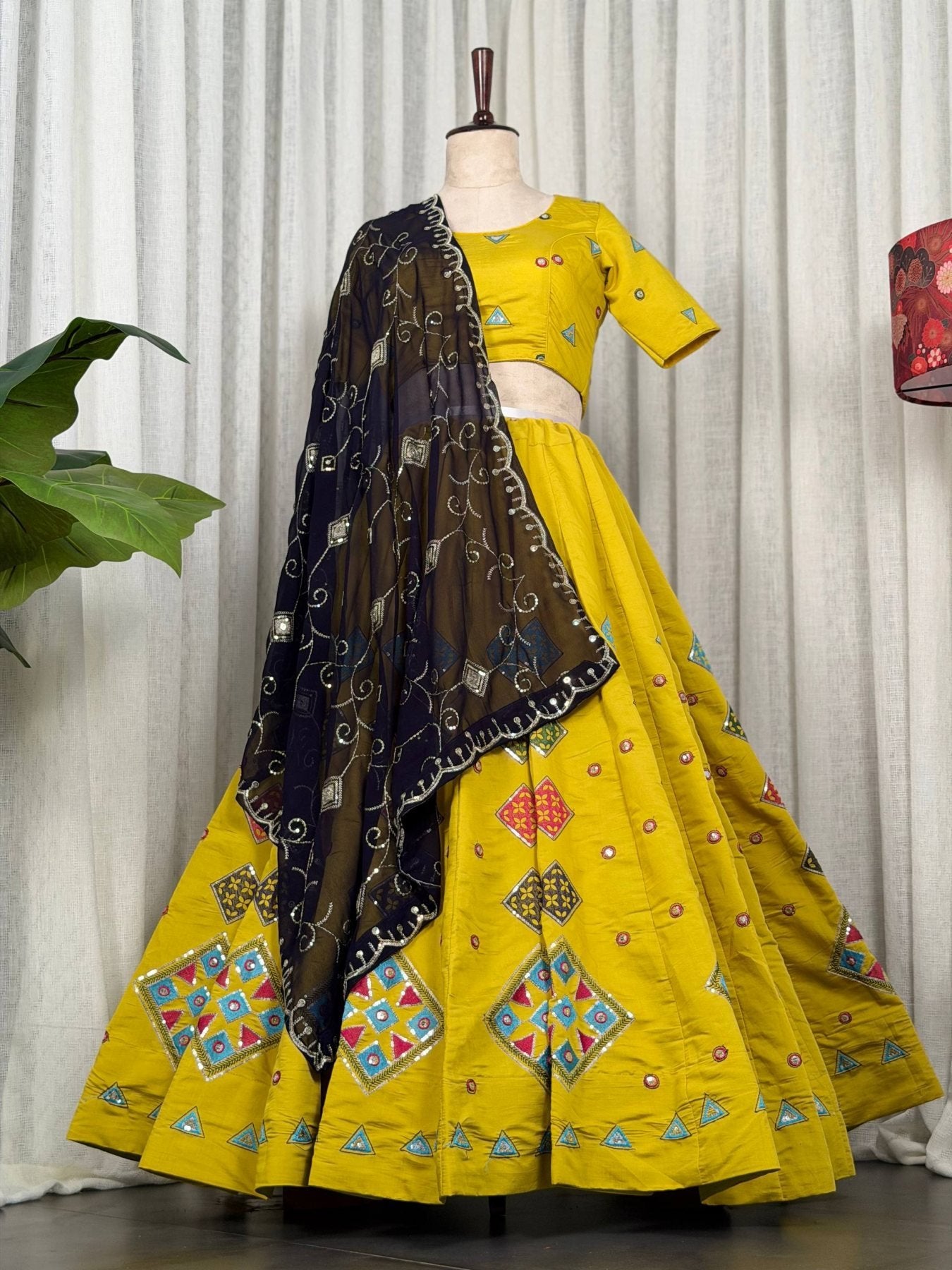 Yellow Roman Silk Navratri Lehenga Choli with Embroidered Georgette Dupatta fabric texture detail