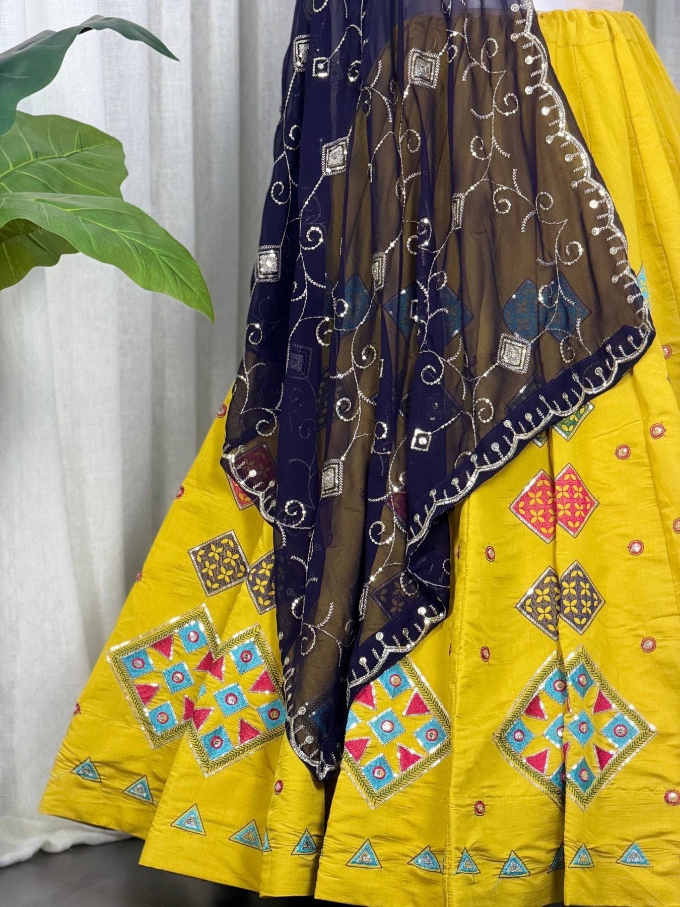 Yellow Roman Silk Navratri Lehenga Choli with Embroidered Georgette Dupatta back view