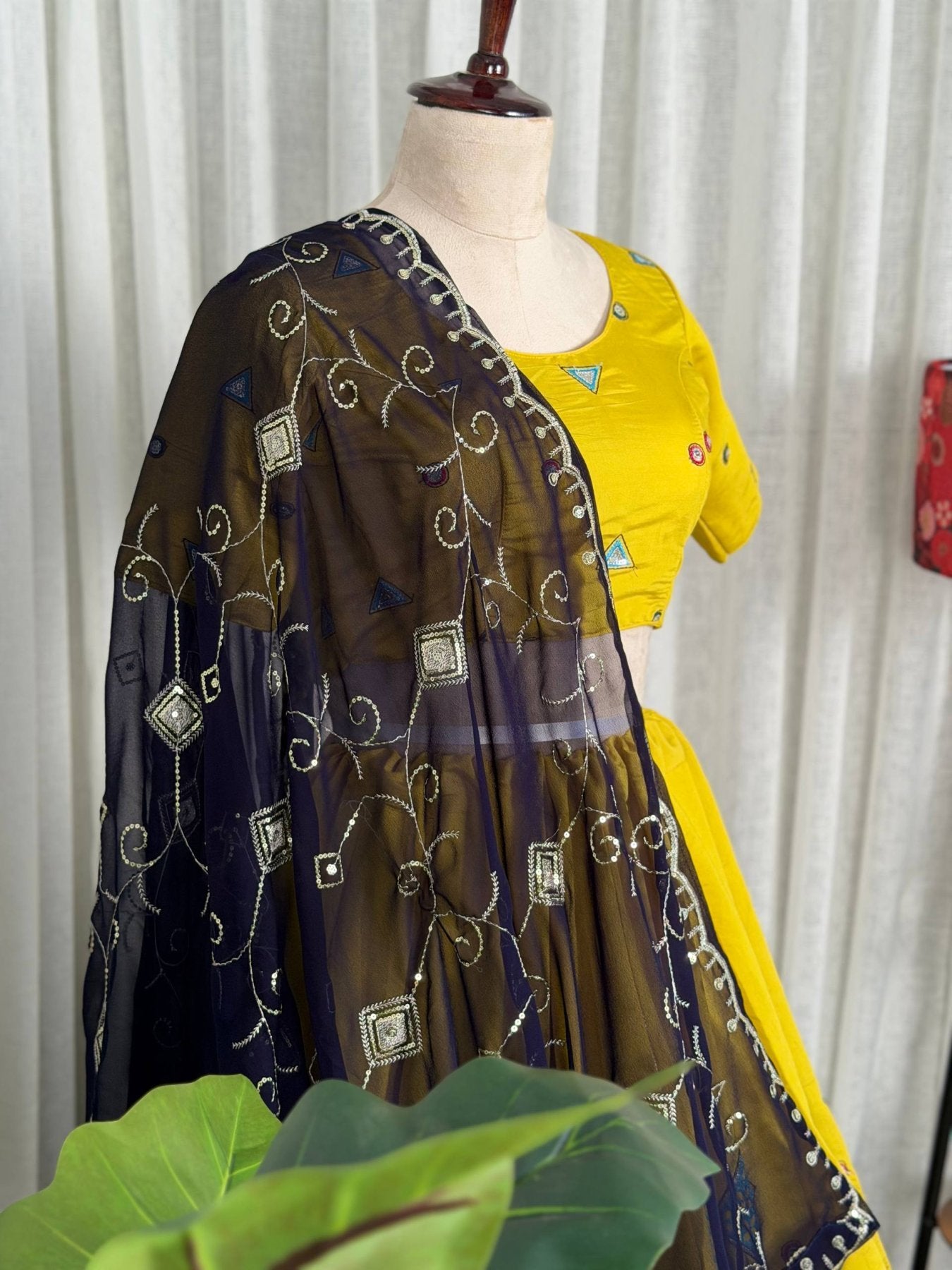 Yellow Roman Silk Navratri Lehenga Choli with Embroidered Georgette Dupatta styling view