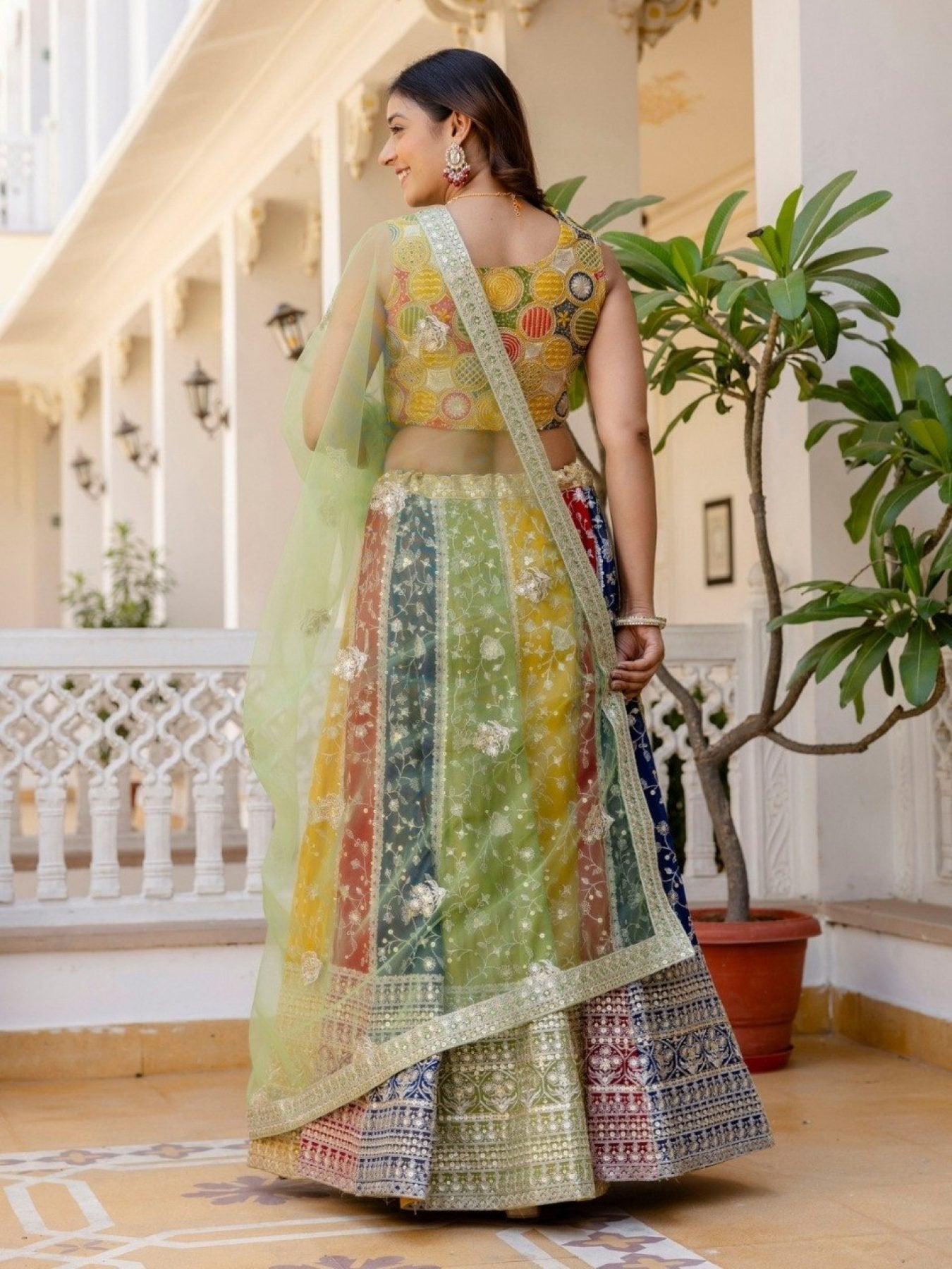 Mutli Faux Georgette Lehenga Choli with Heavy Sequins Embroidery back view