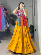 Yellow Rayon Chaniya Choli with Mirror Work and Latkan Dori Lehenga embroidery close-up