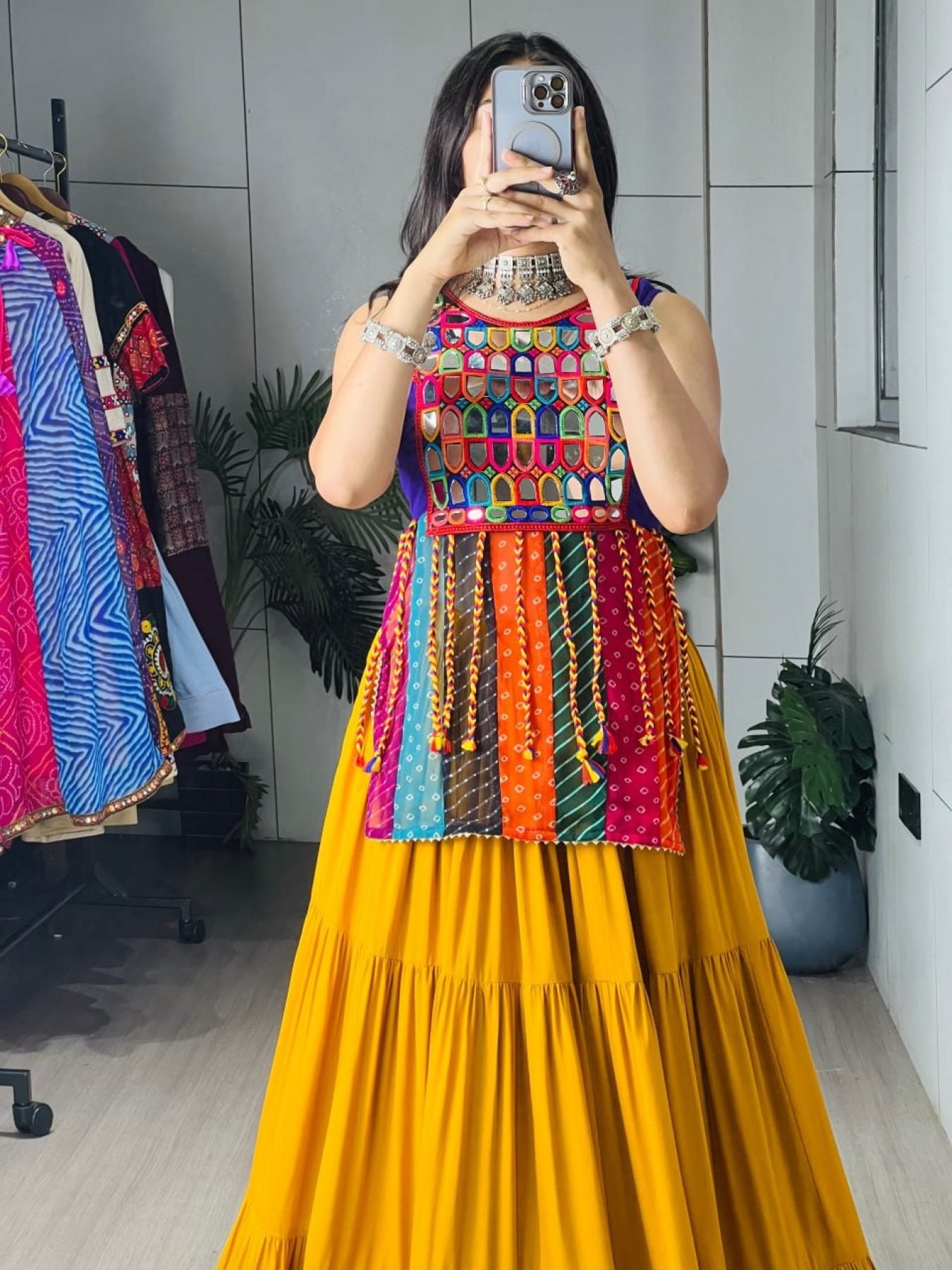 Yellow Rayon Chaniya Choli with Mirror Work and Latkan Dori Lehenga back view