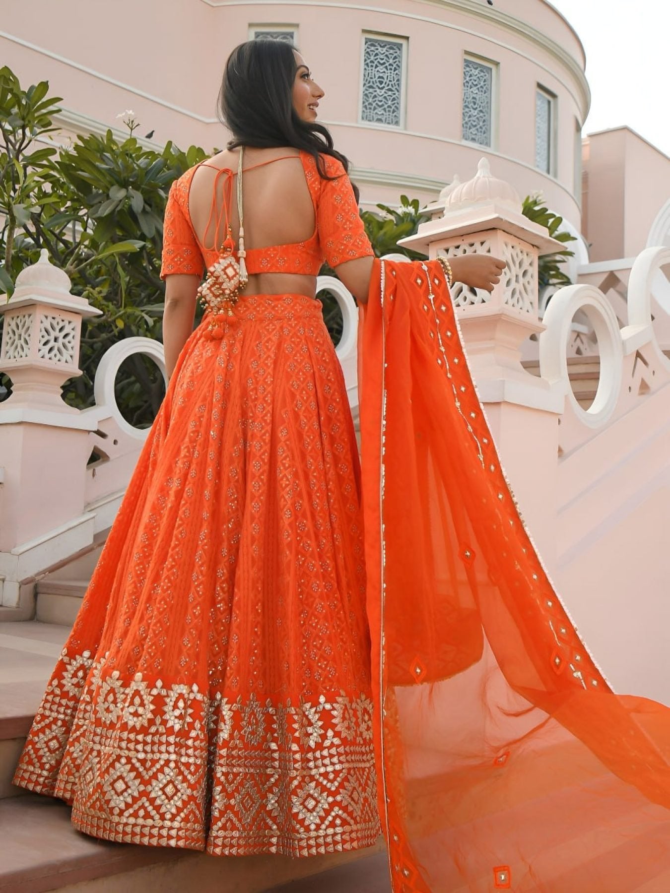 Orange Georgette Wedding Lehenga with Heavy Sequins and Gottapatti Work styling view
